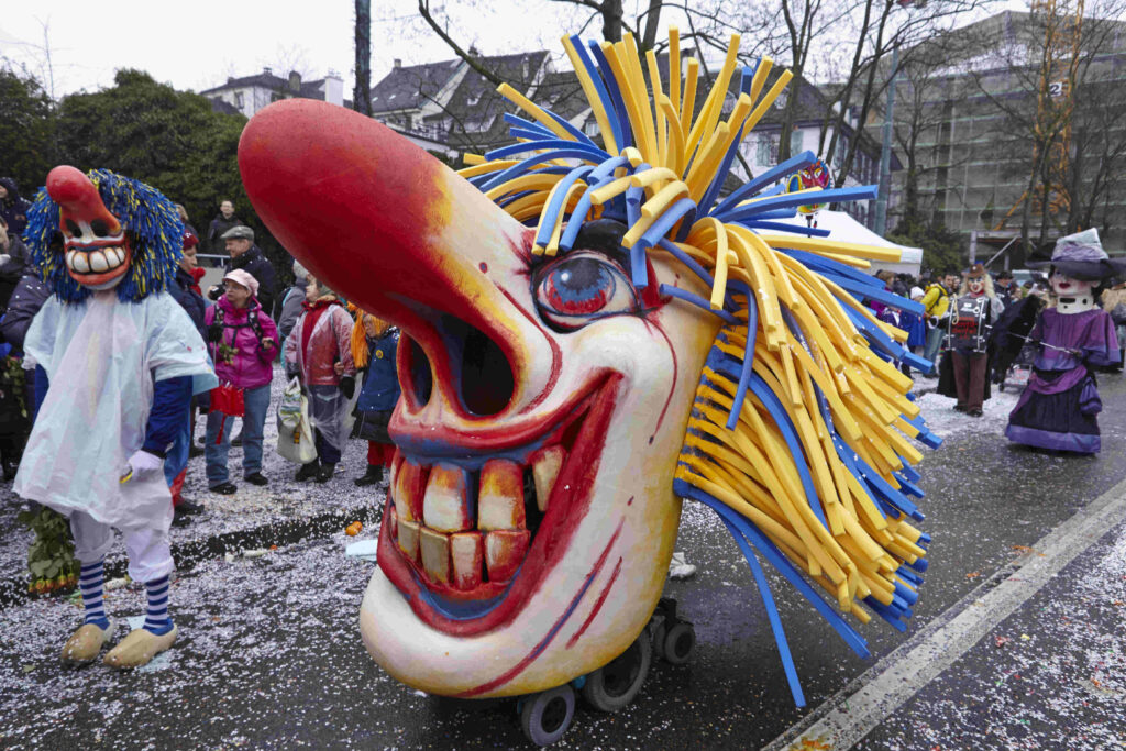 Carnival of Basel 2024: The Cortege - Tourist Information and Insights (Symbolic Image of a past Carnival, symbolizing english speaking users interested in information on the Carnival of Basel 2024.)